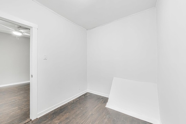 spare room featuring dark hardwood / wood-style floors and ceiling fan