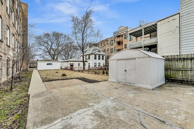 view of patio featuring a shed