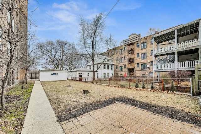 exterior space with an outdoor structure and a patio