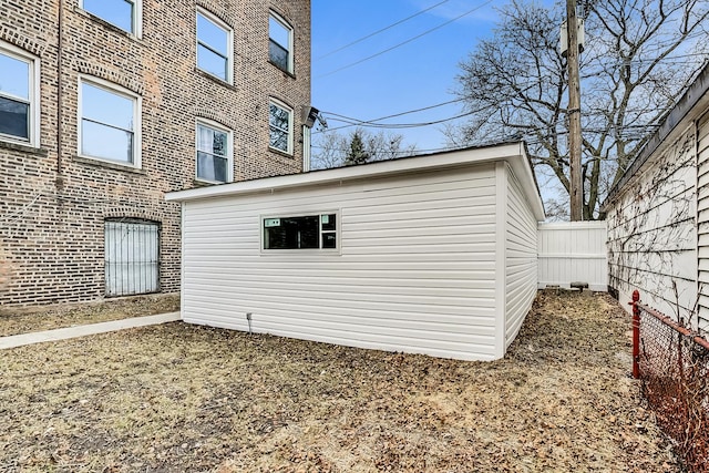 view of property exterior featuring an outbuilding