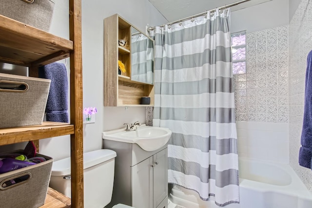 full bathroom featuring vanity, shower / bath combination with curtain, and toilet