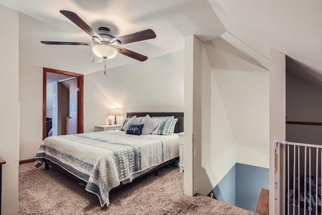 carpeted bedroom with ceiling fan and lofted ceiling