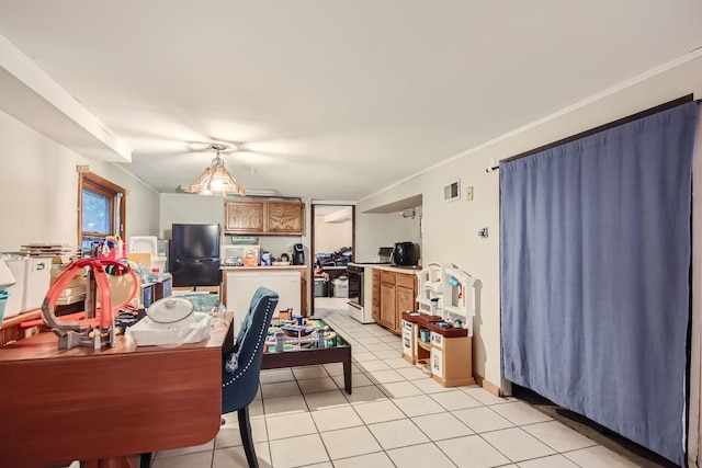 dining area featuring light tile patterned flooring and crown molding