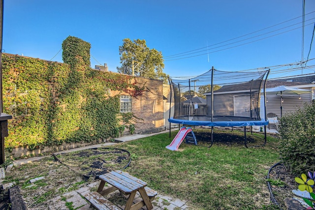 view of yard featuring a trampoline