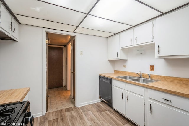 kitchen featuring black appliances, light wood-type flooring, white cabinetry, and sink