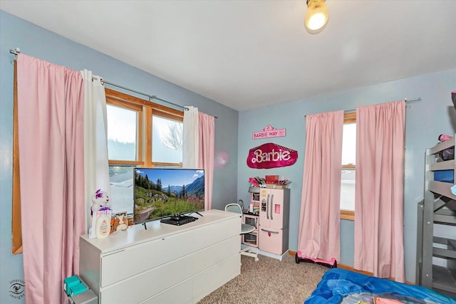 carpeted bedroom featuring multiple windows