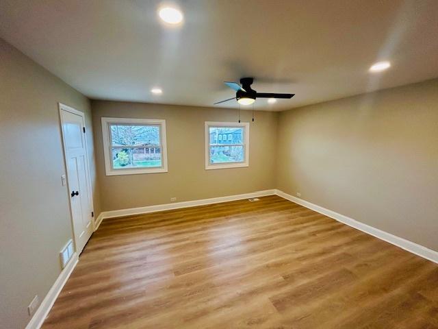 interior space with hardwood / wood-style flooring and ceiling fan