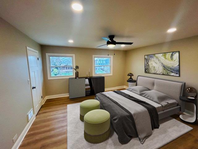 bedroom with ceiling fan and wood-type flooring