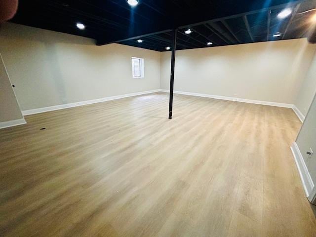 basement featuring wood-type flooring