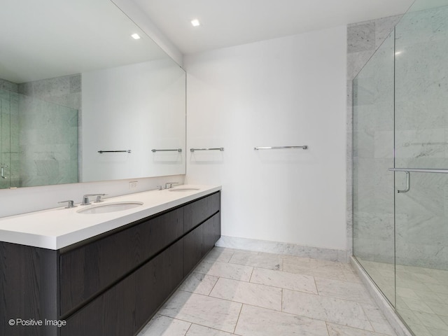 bathroom featuring vanity and a shower with shower door