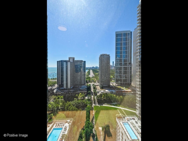 property's view of city with a water view