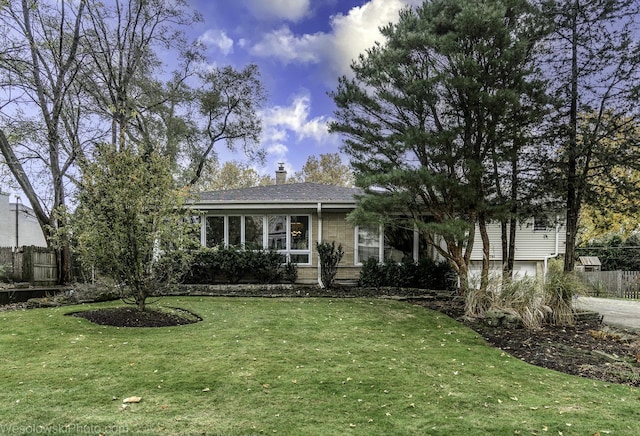 view of front facade with a garage and a front yard