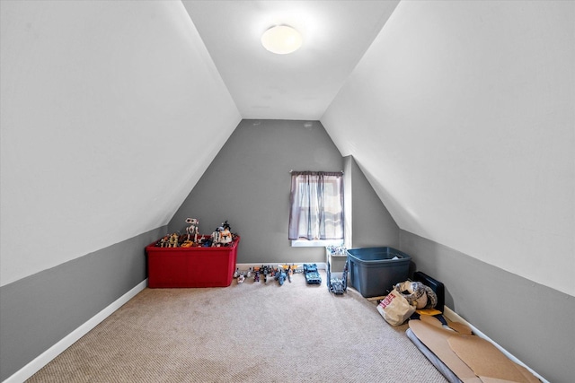 game room with carpet and vaulted ceiling