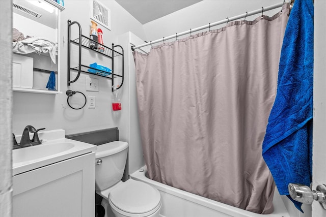 full bathroom featuring vanity, toilet, and shower / tub combo with curtain