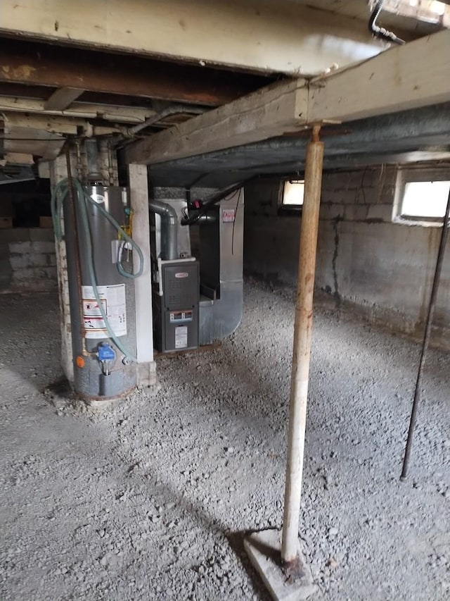 basement with heating unit and water heater