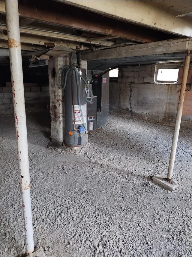 basement featuring heating unit and gas water heater