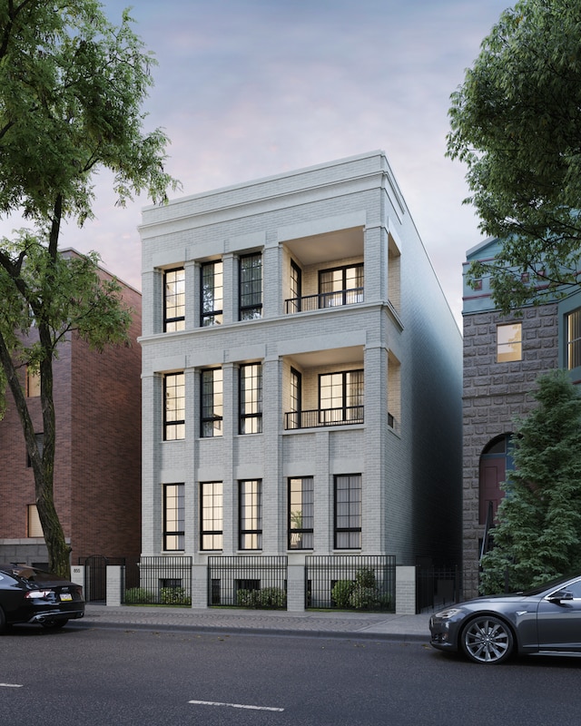 view of front of home featuring a balcony