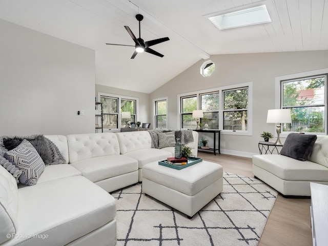 living room with wooden ceiling, ceiling fan, light wood-type flooring, and lofted ceiling with skylight