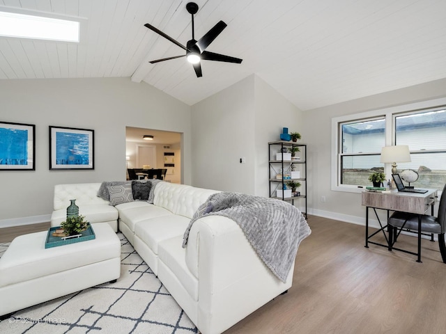 living room featuring ceiling fan, lofted ceiling with beams, wooden ceiling, and light hardwood / wood-style flooring