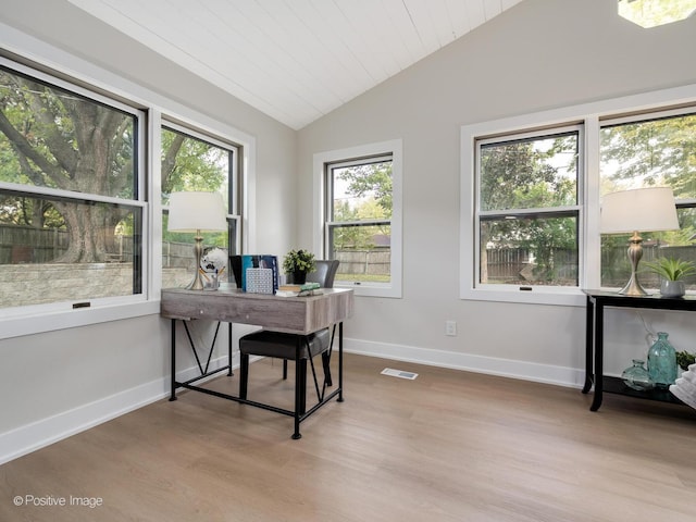 office area featuring wooden ceiling, light hardwood / wood-style floors, a wealth of natural light, and lofted ceiling