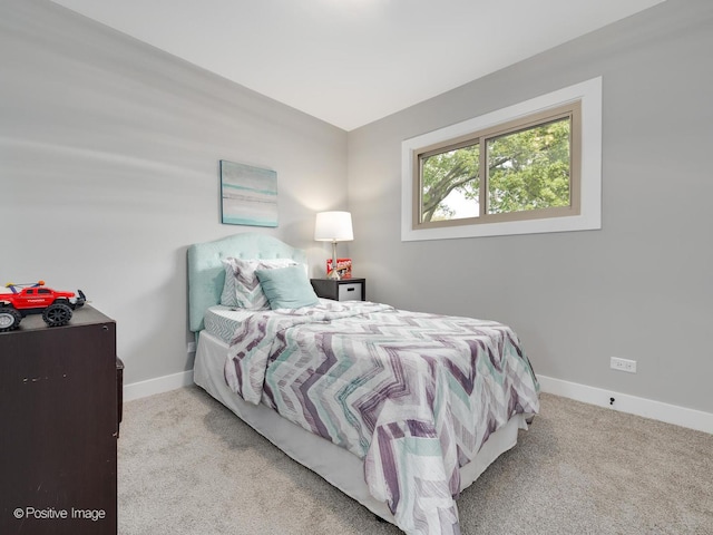 bedroom with light colored carpet