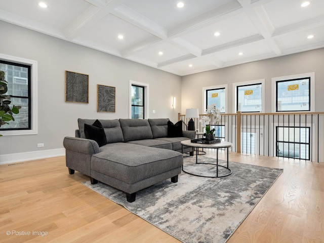 living room with beam ceiling, light hardwood / wood-style flooring, and coffered ceiling