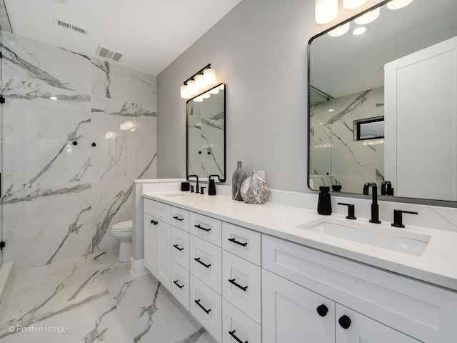 bathroom with walk in shower, vanity, and toilet