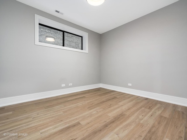 empty room with light wood-type flooring