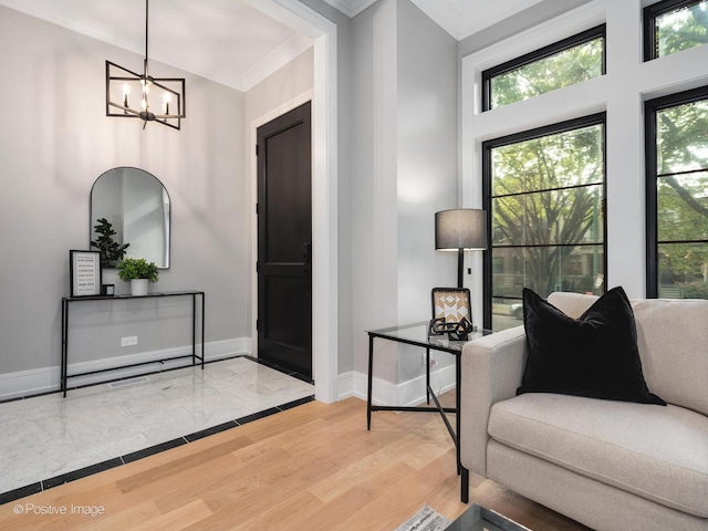 interior space with crown molding, wood-type flooring, and a notable chandelier