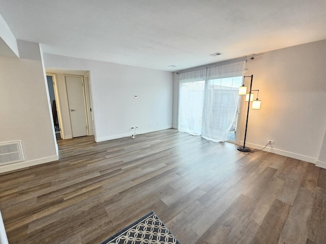 spare room with wood-type flooring