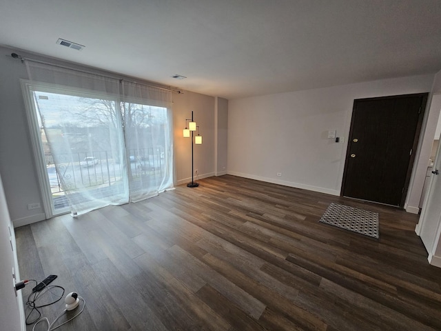 interior space with dark hardwood / wood-style floors