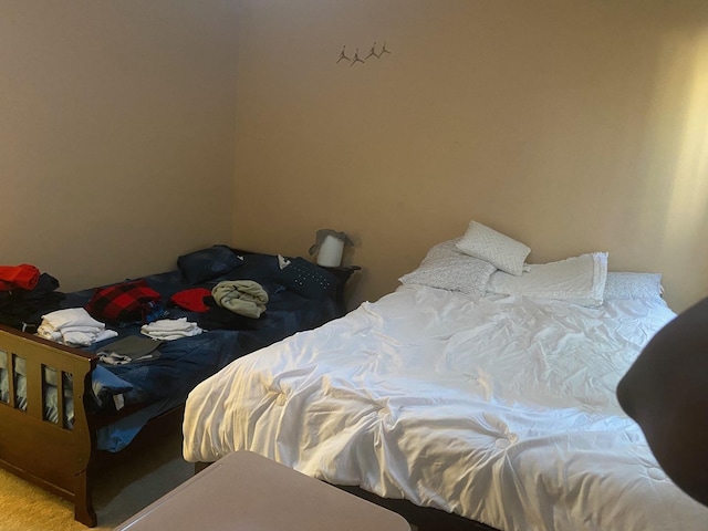 bedroom featuring light colored carpet