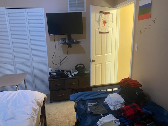 carpeted bedroom featuring a closet