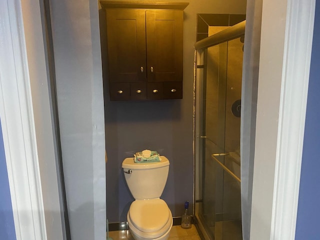 bathroom with walk in shower, tile patterned floors, and toilet