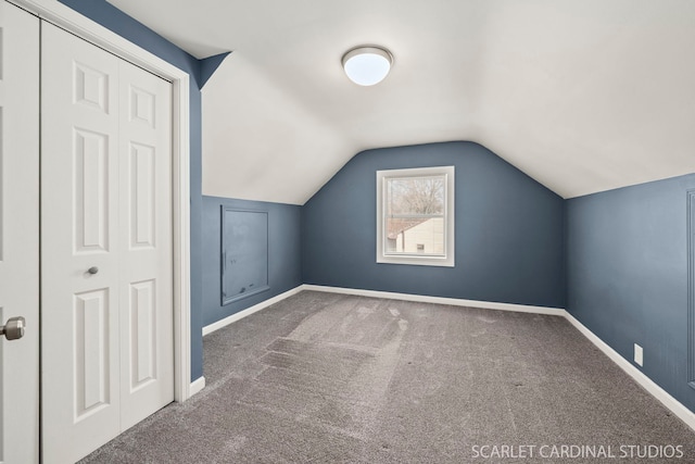 bonus room featuring carpet floors and lofted ceiling