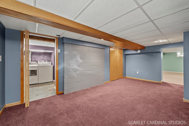 basement featuring washer and dryer and carpet floors