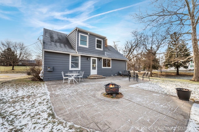 rear view of property featuring a patio