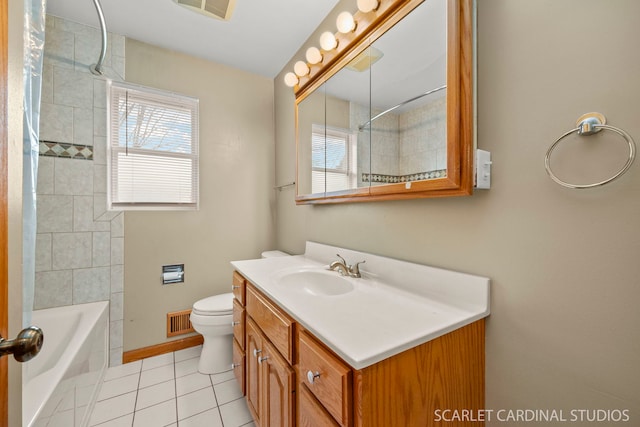 full bathroom featuring a wealth of natural light, tile patterned flooring, vanity, and tiled shower / bath