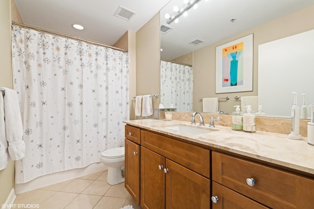 bathroom with toilet, vanity, tile patterned floors, and curtained shower