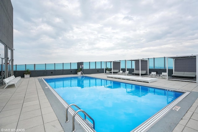 view of swimming pool featuring a patio