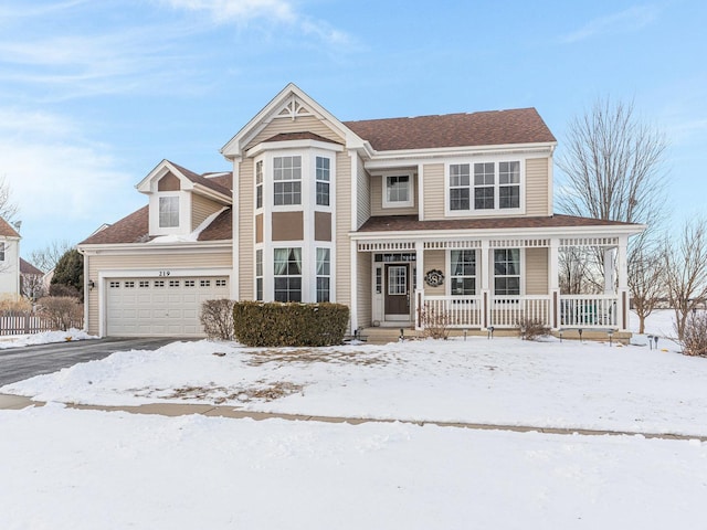 view of front of home with a garage and a porch