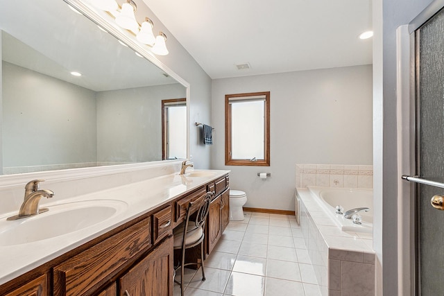 full bathroom with a garden tub, tile patterned flooring, a sink, and visible vents