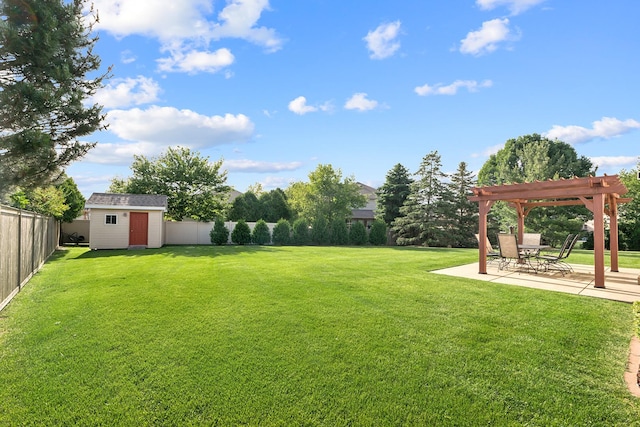 view of yard with a patio, a fenced backyard, an outdoor structure, a pergola, and a shed