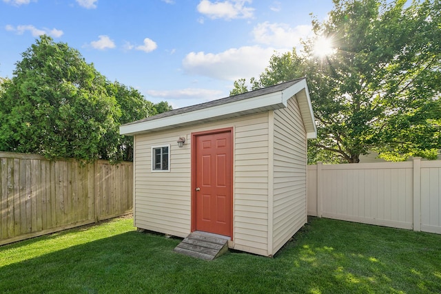 view of shed with a fenced backyard