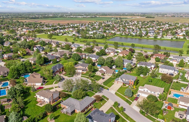 aerial view with a water view and a residential view