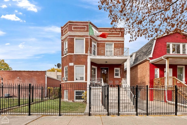 view of front of property with a balcony and cooling unit