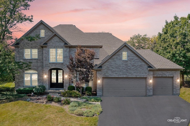 view of front of house featuring a garage and french doors