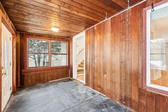 unfurnished sunroom with wooden ceiling