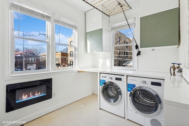 washroom featuring washer and clothes dryer