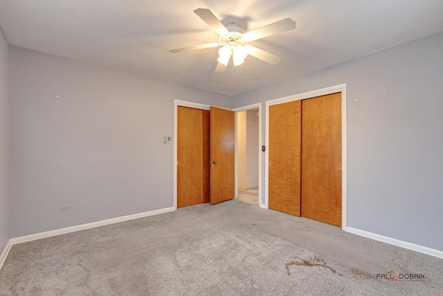 unfurnished bedroom with light colored carpet and ceiling fan